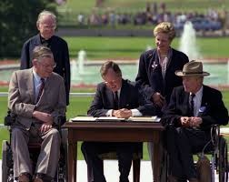 Image of President George H.W. Bush signing the Americans with Disabilities Act