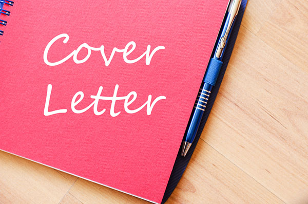 Image of a pen with a notebook with "Cover Letter" written on it