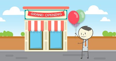 ben holding balloons in front of a storefront with a sign reading Grand Opening