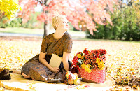 Woman smiling and having a picnic