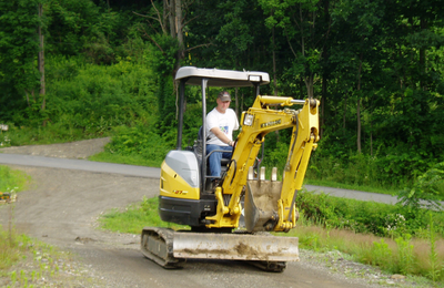 Marty operating a small backhoe