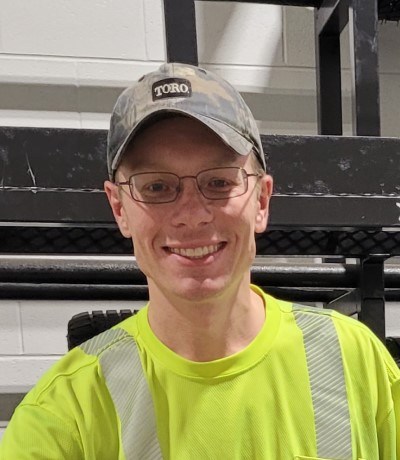 Andy in tire room at work