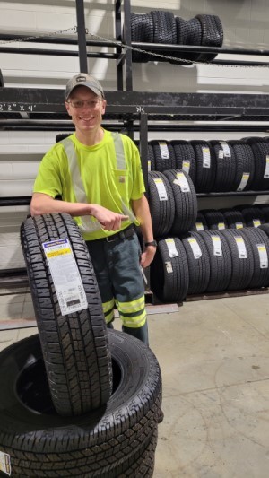 Andy in tire room at work
