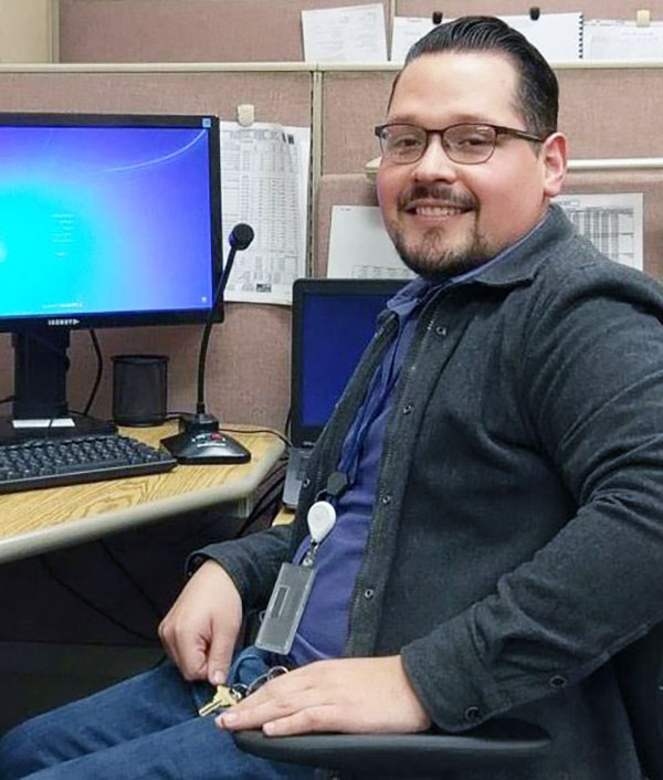 Picture of Jesus sitting in front of a computer