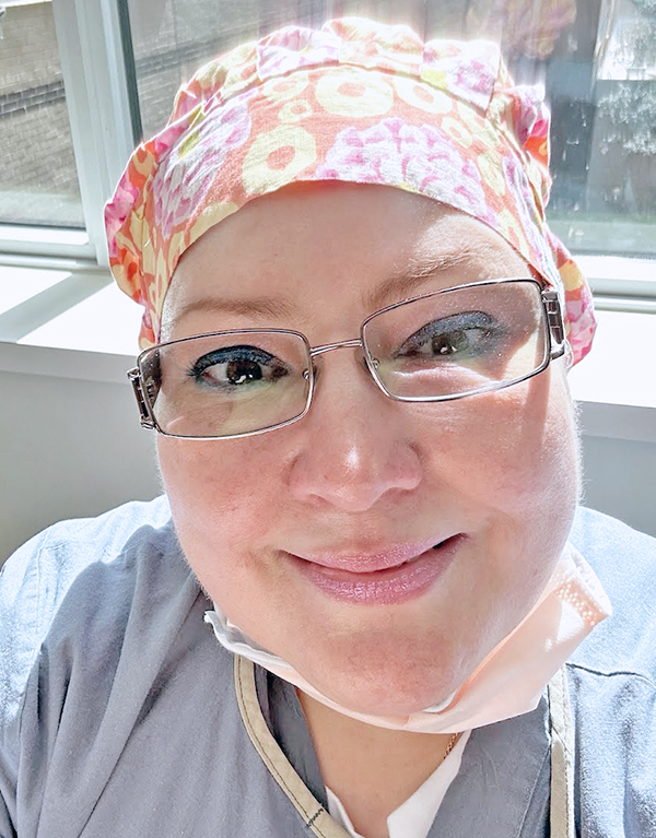 Frances, a Ticket to Work Success Story feature, in light blue scrubs and an orange cap with flower designs, smiling at the camera.