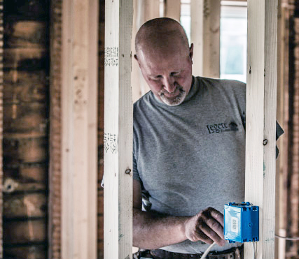 Photo of Marty installing electrical wiring Photo of Marty installing electrical wiring