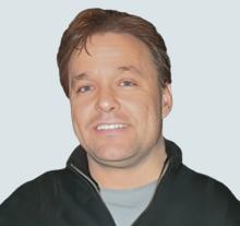 Chris smiling at the camera